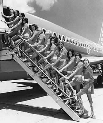 retro stewardesses with gogo boots boarding plane